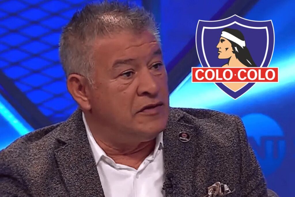 Primer plano de Claudio Borghi junto al escudo de Colo-Colo.