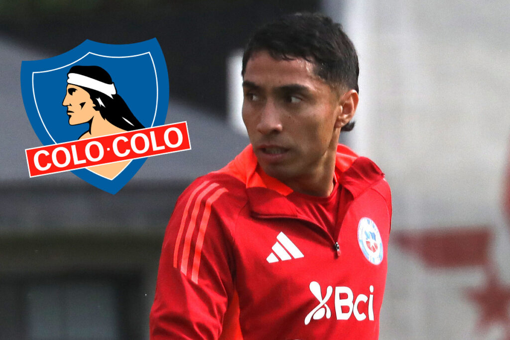 Luciano Cabral junto al escudo de Colo-Colo.